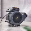 Lightweight 150W Ground Blower drying a wet floor in a garage