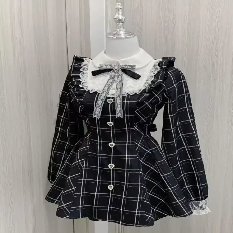 Front view of the black and white plaid Kawaii Lolita dress on a mannequin, highlighting its design and details.