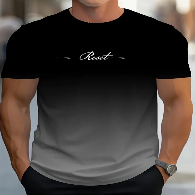 A man wearing a black-to-gray gradient graphic tee with the word "Reset" printed in white across the chest.
