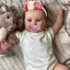 Vinyl Girl Reborn Doll – MRB 50CM Hand-Painted - A close-up of a lifelike doll with hand-painted details, rooted brown hair, and high-quality acrylic eyes.