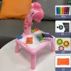 LED Projector Drawing Table - A child using the built-in LED projector to trace and color designs on the translucent drawing surface