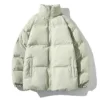 A light beige men's winter parka jacket with a high collar, front zipper closure, and multiple pockets.