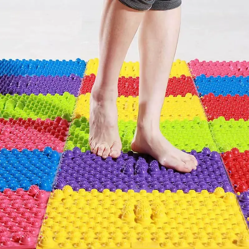 Close-up view of a green aAcupressure Foot Massage Pad with uniform circular patterns.