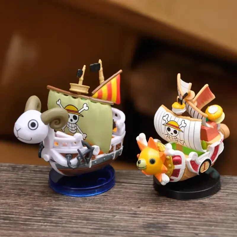 One Piece Ship Figure Collection: Two vibrant ship figures displayed on a wooden surface, highlighting their intricate designs.