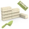 Beach toys set for kids featuring a stackable sand mold, trowel, and rectangular tool with ergonomic handles.
