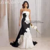 EVON BRIDAL Black and White Evening Gown - Elegant mermaid gown with floral detailing.