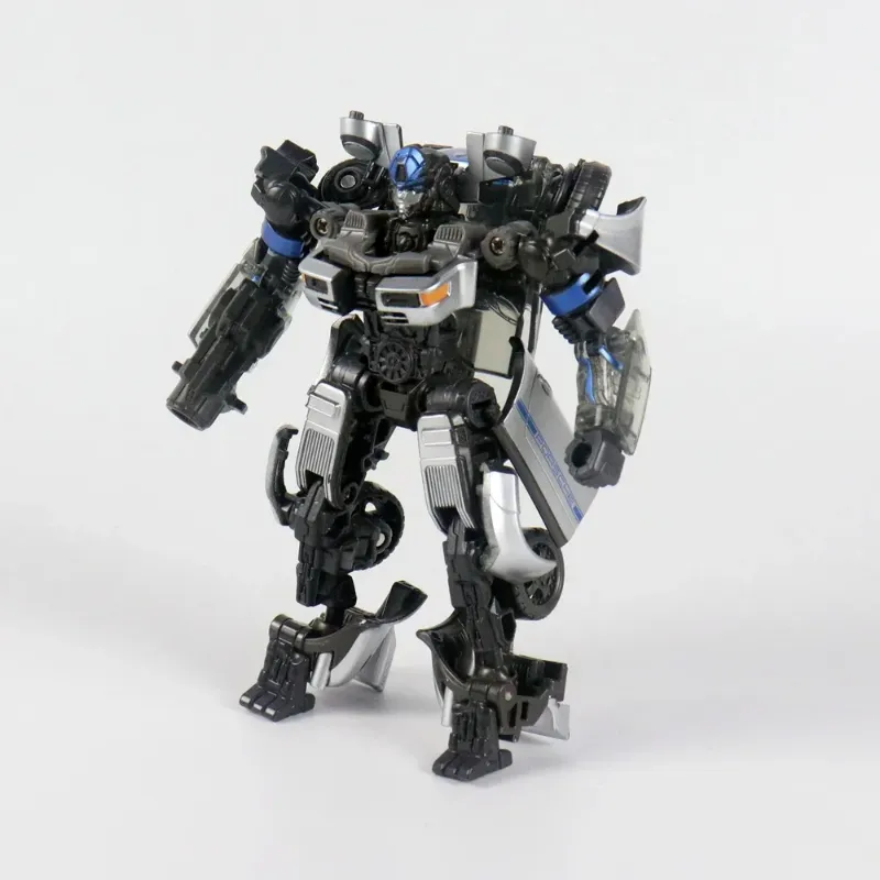 A three-quarters standing view of the BMB Mirage action figure in robot mode, highlighting the complex mechanical details on its chest, legs, and arm cannon.