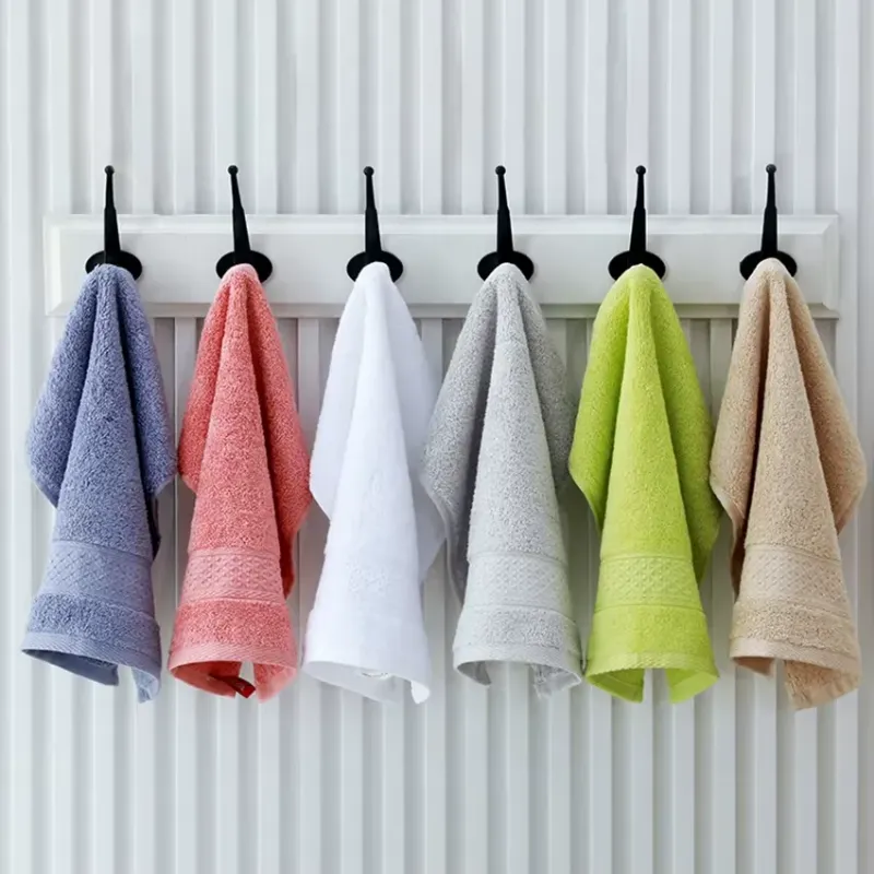Colorful Soft Versatile Cotton Handkerchiefs hanging on hooks, adding a pop of color to the bathroom decor.