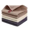 Stacked Cotton Hand Towel Set in neutral tones, featuring a waffle weave texture.