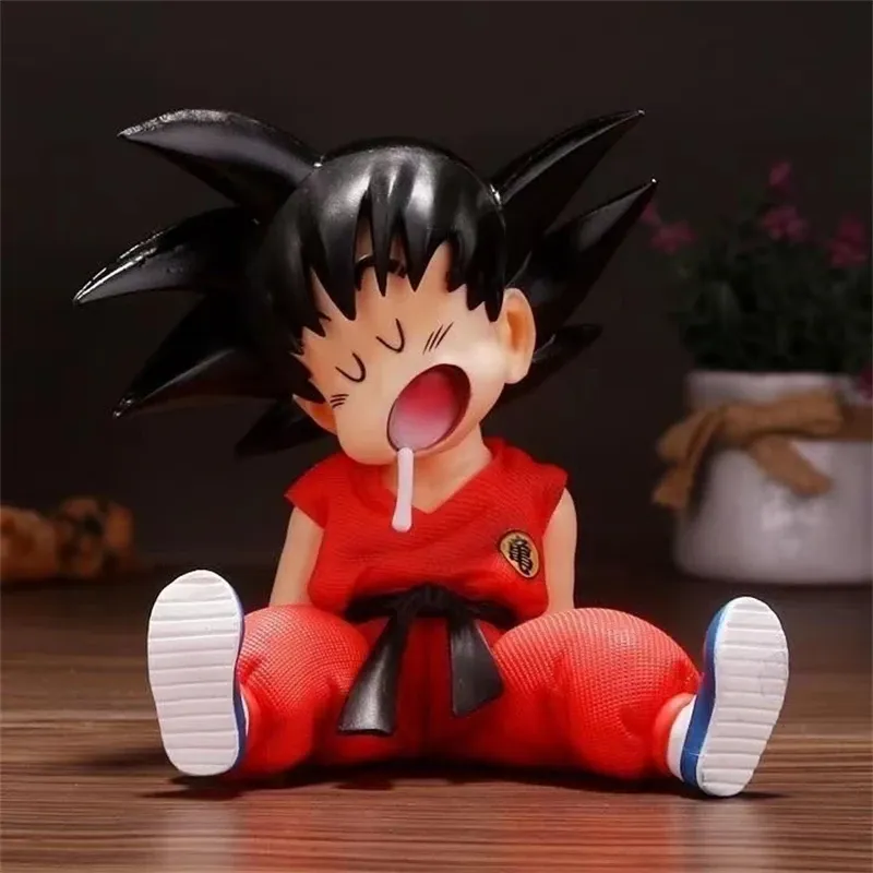 Dragon Ball Goku Figure – Detailed Sitting Pose with Tongue Out.