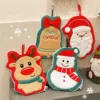 Snowman Christmas Towels: Festive holiday towels featuring a snowman, reindeer, and Santa Claus designs.