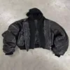 Oversized Black Leather Bomber Jacket with a hooded layer underneath, showcasing its bold and edgy design.
