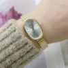 Sustainable bamboo band on oval women’s wristwatch