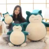 Two sizes of the Pokémon Sleeping Plush Doll of Snorlax, showcasing its versatility as a cozy bedtime buddy.
