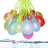 A cluster of Quick Fill Water Balloons hanging and ready to be filled, with water droplets glistening on their surfaces.