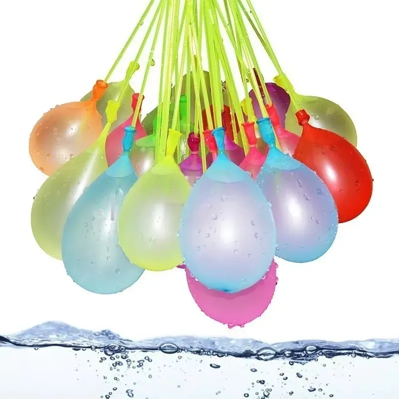 A cluster of Quick Fill Water Balloons hanging and ready to be filled, with water droplets glistening on their surfaces.