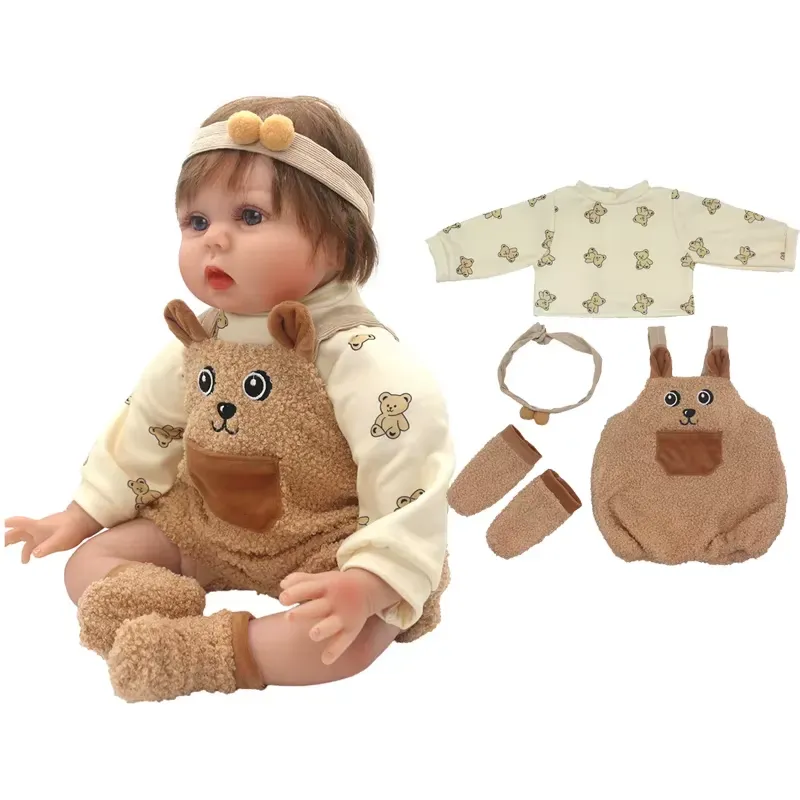 Adorable reborn baby doll dressed in a cozy teddy bear-themed outfit with matching accessories.