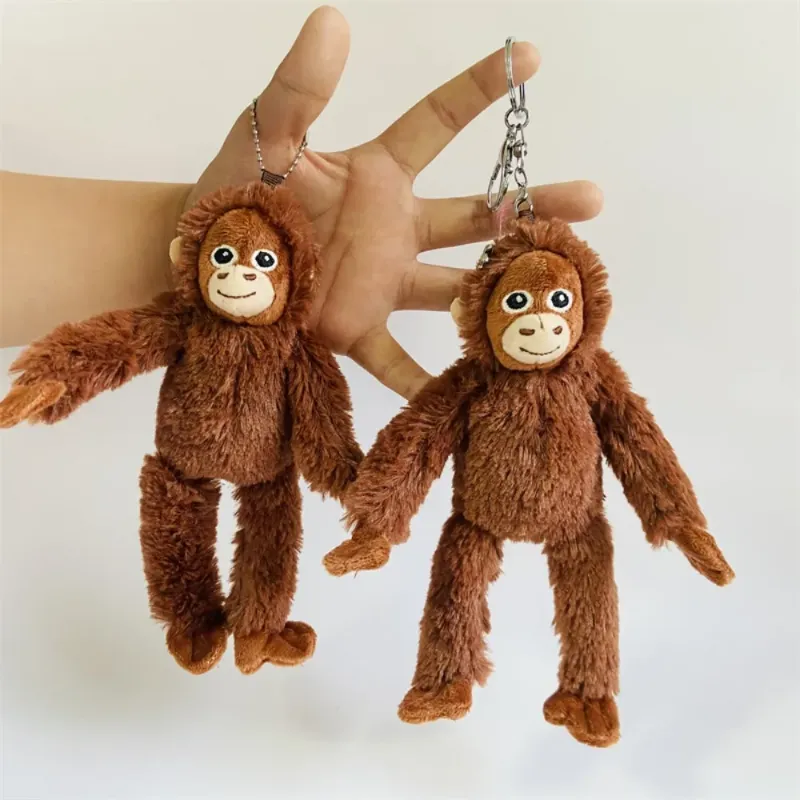 Soft Gorilla Plush Keychains held in hand, showcasing their adorable and fluffy design.