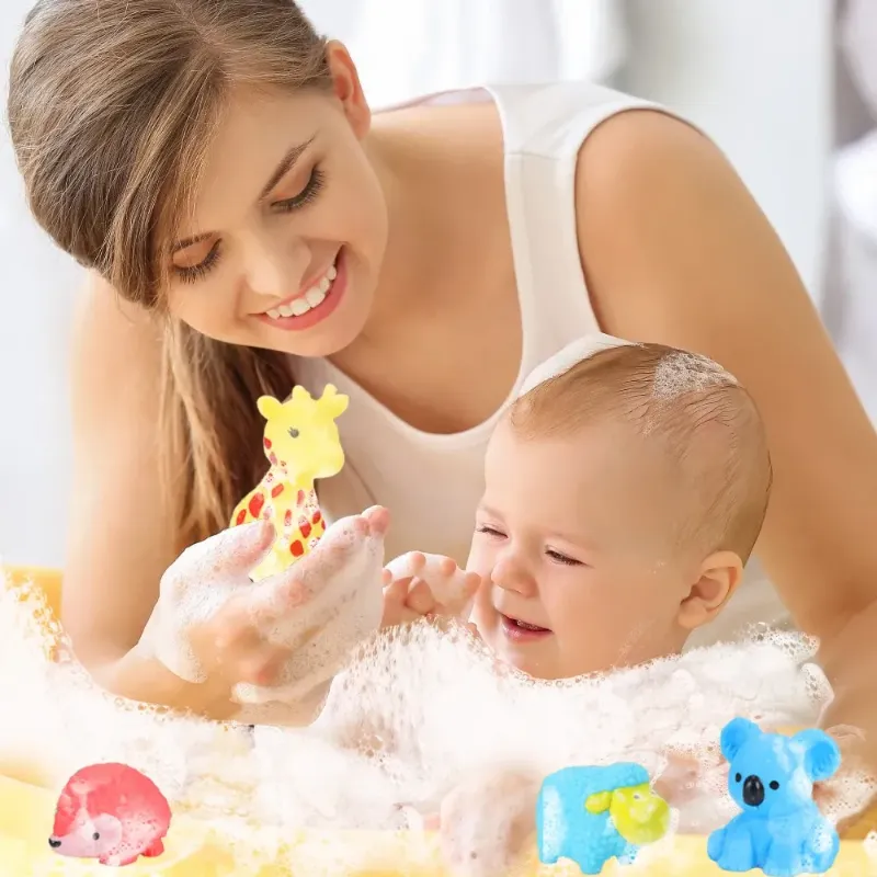 Colorful baby bath toys floating next to a swimming ring in a bathtub