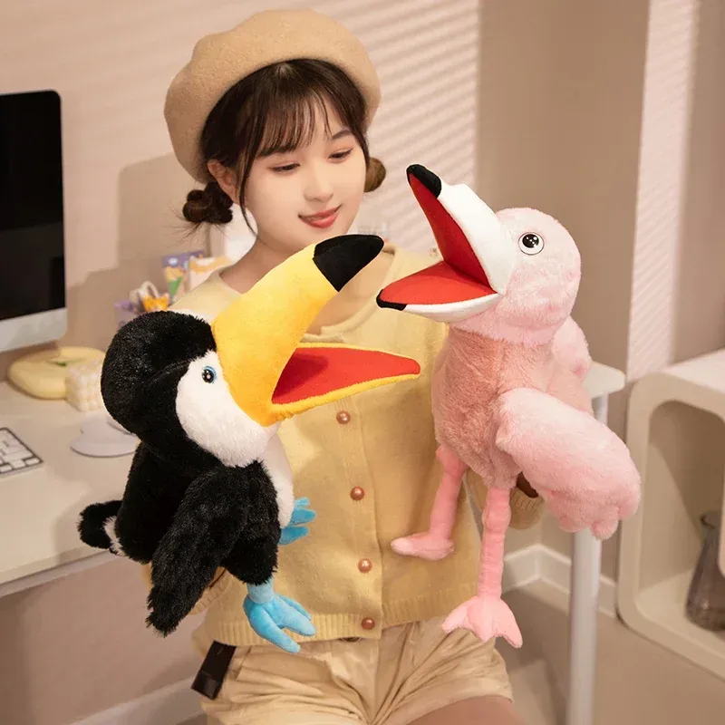 Adorable toucan hand puppet plush toy held by a child, showcasing vibrant colors and playful design.