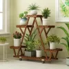 Triangular Plant Shelf - Carbonized wood plant holder with wheels for garden display.
