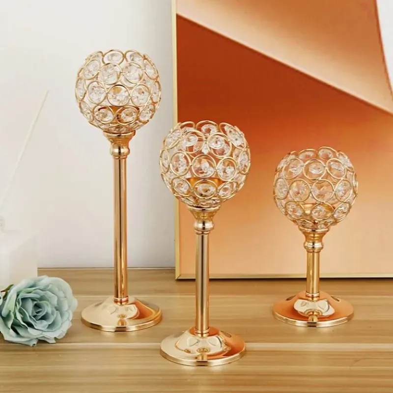 Elegant vintage crystal candle holder with golden finish on wooden table