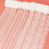 Collection of white lace ribbons in varying widths and designs, showcasing versatility for different crafting needs.