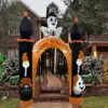 Inflatable Halloween archway with pumpkins and LED lights, standing at a house entrance at night.
