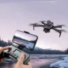 Xiaomi V198GPS Drone capturing stunning aerial footage of a snowy landscape, displayed live on a smartphone screen.