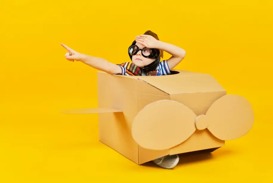 kid in a paper craft