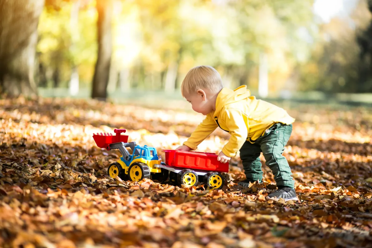 play is playing with a toytruck