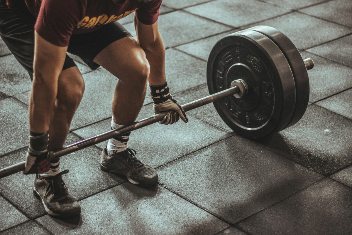 Gym: a man doing deadlift