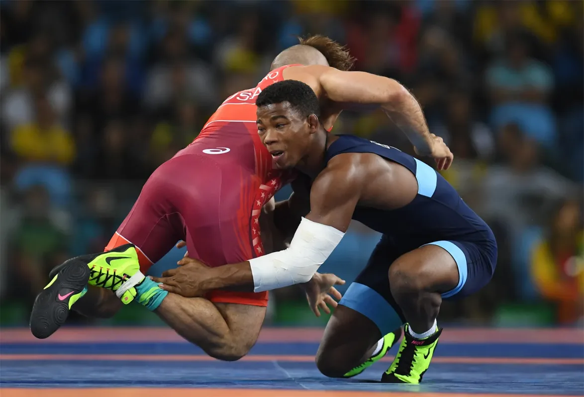 2 men wrestling eachother