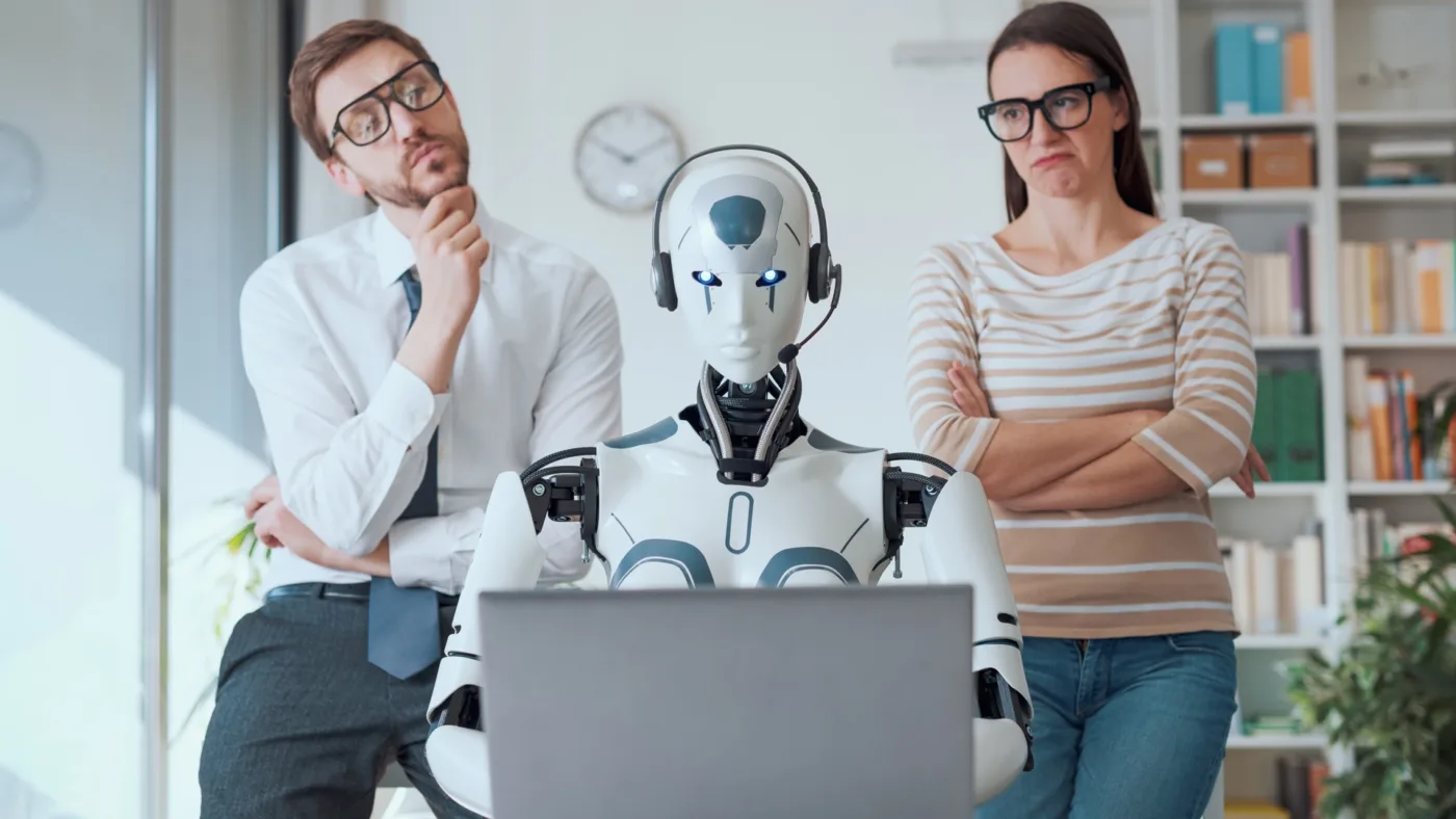 a robot is working and people are watching