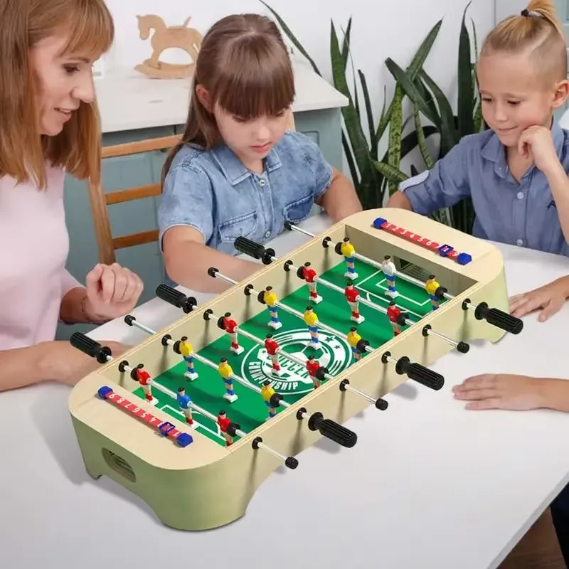 Family Playing with Mini Wooden Table Football