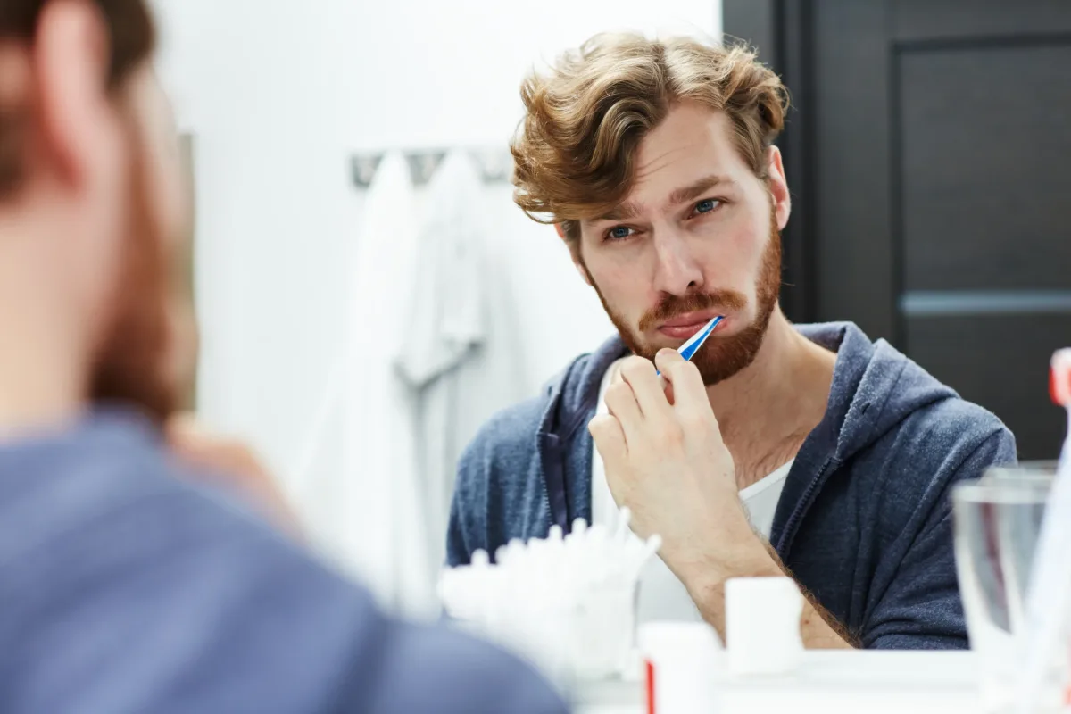Men's Grooming: brushing teeth