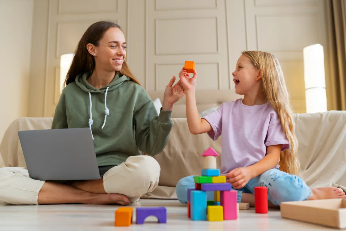 a mother and her daughter are playing with legos and toys