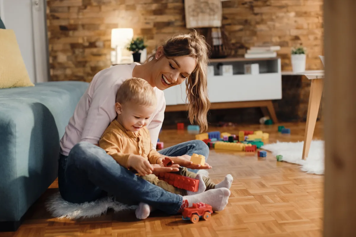 happy-mother-son-playing-with-toy-blocks