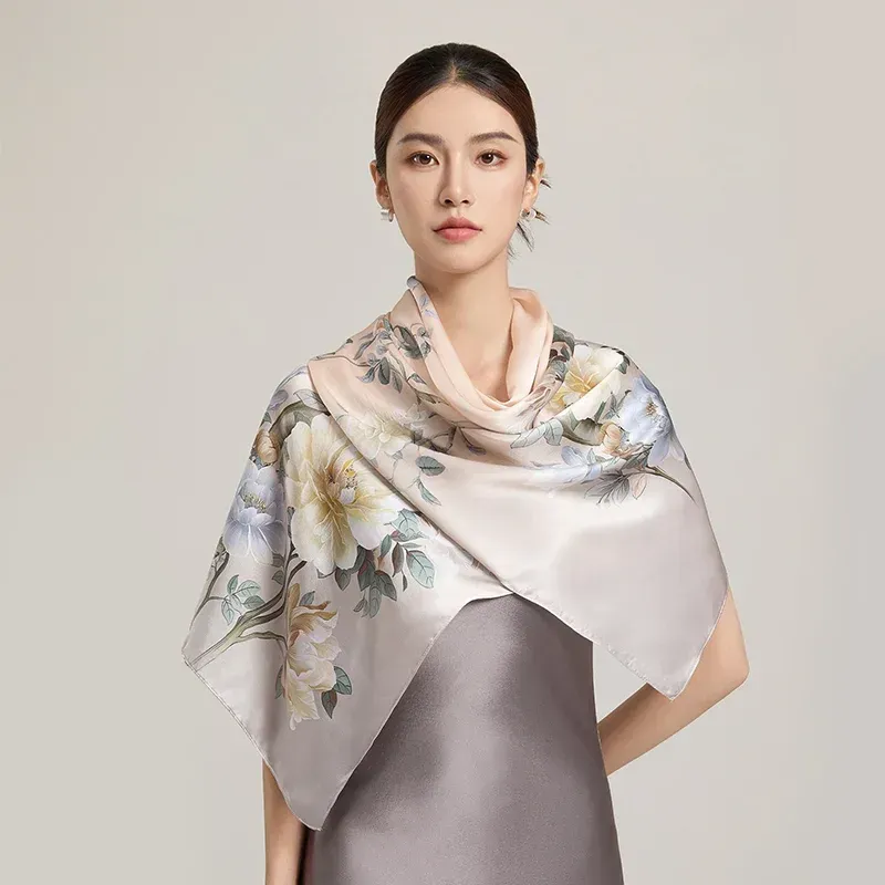 Long silk scarf draped elegantly over shoulders as a shawl for women