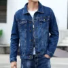 Man in a dark blue mens denim jacket casual, styled with a white t-shirt and jeans.