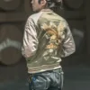 Close-up of the detailed embroidery of a mythical bird on the front of a reversible Sukajan jacket.