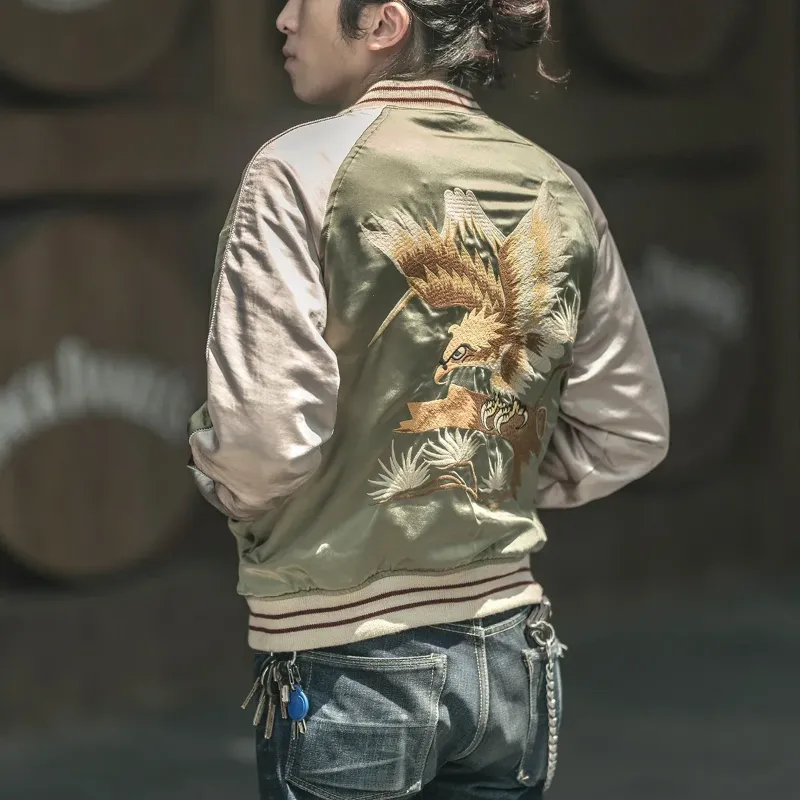 Close-up of the detailed embroidery of a mythical bird on the front of a reversible Sukajan jacket.