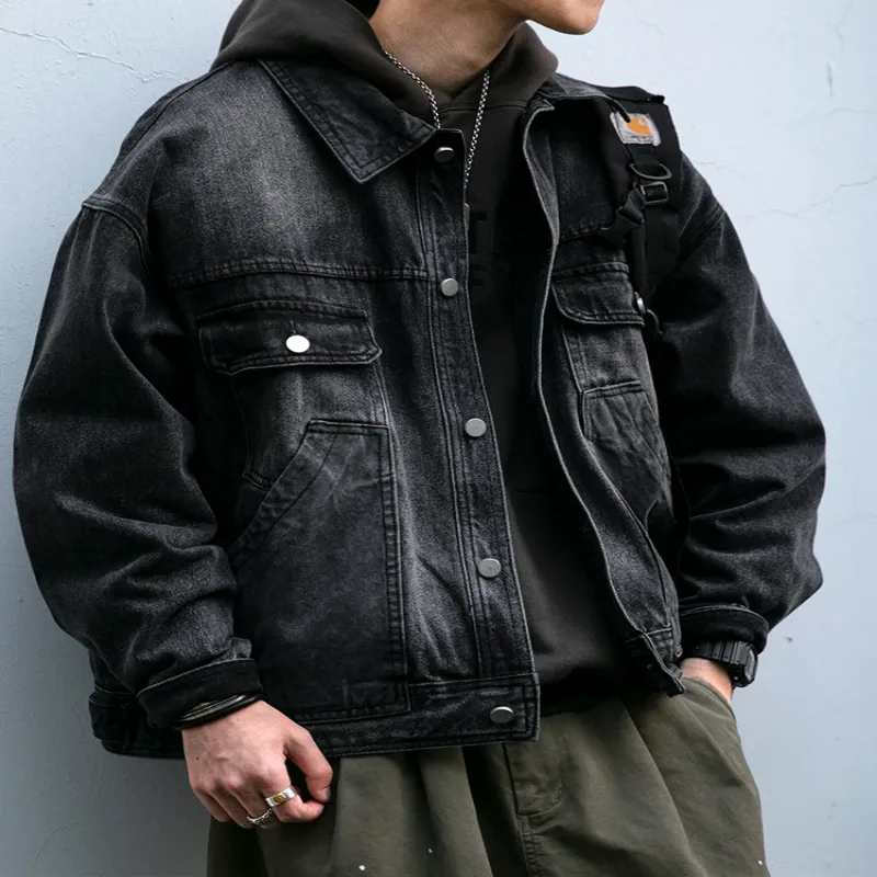 Vintage denim jacket men's outfit with a focus on the jacket's front design and accessories.