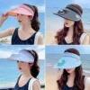 Woman wearing a wide-brim USB fan sun hat outdoors