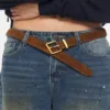 Women's suede leather belt defining waist over wrap dress