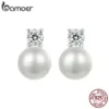 Luxury gift box opening to reveal BAMOER moissanite pearl earrings