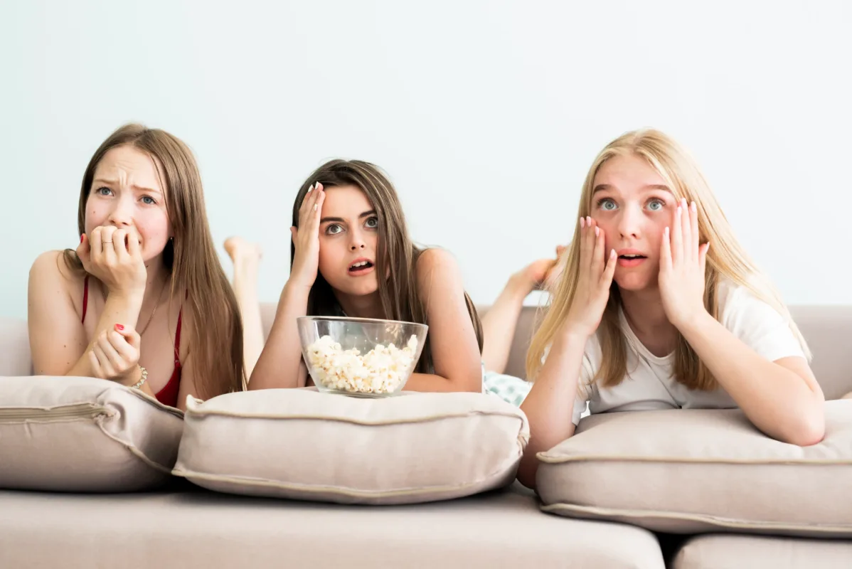 3 girls are watching movie