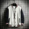 Clean and classic gray men's bomber jacket fleece with navy accents and striped cuffs.