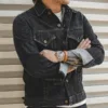 Man confidently wearing a Men Denim Jacket Slim, accessorized with a watch and leather bracelet.
