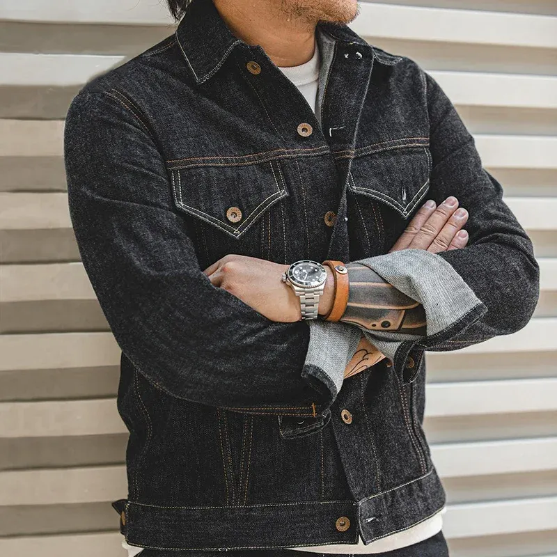 Man confidently wearing a Men Denim Jacket Slim, accessorized with a watch and leather bracelet.